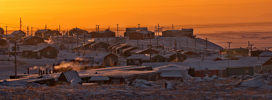 Arctic community at sunset